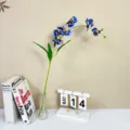 Artificial blue flower branch detail for home decor, elegant silk floral arrangement prop. - Sapphire Blue