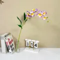 Artificial phalaenopsis orchid flower detail, elegant purple silk floral decor for home interior. - Yellow Center Purple