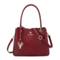 Wine red litchi pattern women's shoulder handbag with metal kangaroo logo and charm. - Red