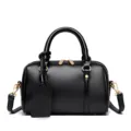 Black leather Boston bag, classic small pillow handbag with top handles and shoulder strap. - Black