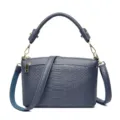 Blue leather crossbody bag with chic animal texture, top handle and adjustable shoulder strap. - Blue