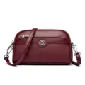 Wine red leather double layer shell phone bag with metal heart logo and shoulder strap. - Red