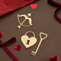 Detailed view of gold acrylic cake toppers, heart lock and key design for Valentine's day. - Cupid's Arrow / Approx Width 4.5cm