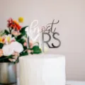 Detailed close-up shot of the elegant mirror acrylic almost mrs cake topper for parties. - almost Mrs / Approx. 10cm Width / Silver