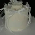 Detail shot of white cake with delicate ribbons, pearl beads and crystal moon decoration. - Moon With Double Layer Bow / 4 Pieces/Pack