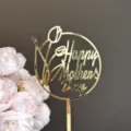 Gold acrylic Mother's Day cake topper detail featuring tulip and lettering design for party decor. - Tulip Happy Mother's Day / Gold