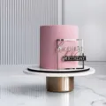 Detail view of the elegant acrylic happy birthday cake side topper in modern style. - Rose Gold