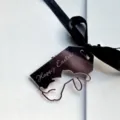 Close-up of Easter acrylic rabbit tag with black ribbon, detailed holiday decor topper. - Happy Easter Rose Gold Rabbit Pendant