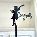 Black acrylic graduation cake topper featuring congrats text for party celebration. - Girl Congrats / Black