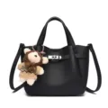 Black leather lock handbag with plush bear pendant, elegant women bucket shoulder bag. - Black