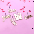 Gold acrylic love cake topper set, various romantic cursive typography designs for Valentine's day. - Design No. 1 "Love"