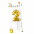 Gold number 2 birthday candle cake topper with party packaging for celebrations and events. - Number Candle Gold 2