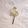 Gold acrylic Easter bunny cake topper with floral cutouts, perfect for holiday party desserts. - 2 Gold Bunny Cupcake Toppers