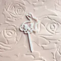 White Easter rabbit cake topper with floral design, perfect for holiday party dessert decoration. - 2 White Bunny Cupcake Toppers