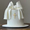White fondant cake with bow and gold cross cake topper variant dessert decoration item. - Small Gold Cross