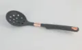 Close-up of dark grey silicone slotted spoon featuring a rose gold accent and hanging hole. - Skimmer