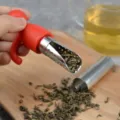 Silicone and stainless steel tea infuser with cute human shape design, portable tea strainer. - Red