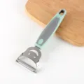 Stainless steel kitchen fruit vegetable peeler with ergonomic green plastic handle. - Smiley Face Triangular Grater