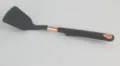 Black silicone kitchen spatula detail shot with stylish copper accent ring and convenient hanging hole. - Turner Spatula