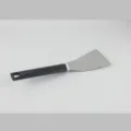 Stainless steel kitchen spatula with durable black plastic handle for cooking and baking. - Cake Server