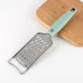 Stainless steel kitchen cheese grater with green non-slip handle for home cooking use - Large Hole Ginger Graters