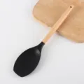 Cucchiaio da cucina in silicone nero con manico in legno, utensile resistente per cucinare. - Small shovel