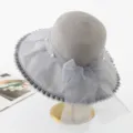 Detailed view of grey wide brim organza sun hat with elegant pearl and bow for women beach. - M (56-58cm) / Pearl Full Crown Style - Grey