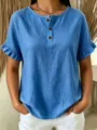 Detail view of blue linen short-sleeve top featuring ruffle cuffs and buttoned neckline. - S / Tops / Blue