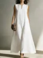 Detail view of a minimalist white sleeveless V-neck maxi dress with front pockets. - 3XL / Dresses / White