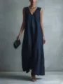 Detailed view of the elegant deep blue sleeveless v-neck long dress in studio setting. - S / Navy Blue
