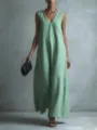 Detail view of a casual light green V-neck sleeveless long dress worn by a model. - Light Green