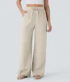 Gedetailleerd overzicht van casual dames linnen broek met hoge taille en trekkoord voor zomer. - S / Abrikoos