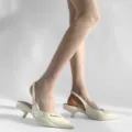 Sheer rhinestone diamond pattern tights paired with elegant white kitten heel slingback shoes for women. - One Size / Milk White