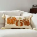 Autumn pumpkin embroidered pillowcase with tassels, perfect for Thanksgiving and holiday home decor. - Three Orange Pumpkins