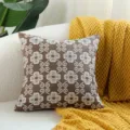 Modern brown jacquard throw pillow cover with elegant white floral pattern for living room. - Coffee