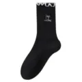 Calcetines negros de mujer con borde de volantes blancos y bordado de lazo. Cómodos y elegantes. - Talla única / Negro
