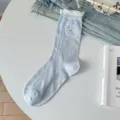 Calcetines de algodón azul claro con tierno bordado de cachorro y puños con volantes. - Talla única / Azul cielo