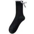 Calze al polpaccio nere da donna con bordo volant bianco e fiocco nastro stile carino - Taglia unica / Nero con bordo bianco