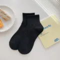Black mid-tube cotton socks for women, casual preppy style daily wear, breathable basic hosiery. - One Size / Black