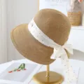 Summer straw sun hat for women with elegant white polka dot bow ribbon wide brim beach cap. - M (56-58cm) / Khaki