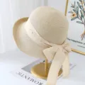 Dames zomer strohoed met brede rand en elegante strik voor strand zonbescherming. - M (56-58cm) / Beige