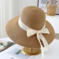 Women summer straw sun hat with white lace ribbon bow beach resort wide brim hat - M (56-58cm) / JS32011 Coffee