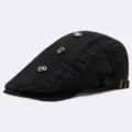 Men's black flat cap cotton ivy newsboy cap with metal grommets and freestyle embroidery. - Standard Size (56-60cm) / Black