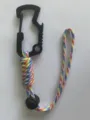 Close-up detail of colorful braided paracord water bottle strap with functional carabiner. - Multicolor