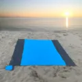 Outdoor waterproof beach blanket detail view, portable foldable picnic mat in blue and grey. - Blue Body with Double Gray