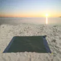Waterproof outdoor beach blanket in dark green with handy storage bag, perfect for camping trips. - Army Green Body with Double Gray