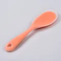 Translucent silicone rice spoon kitchen utensil in light orange color with convenient hanging hole. - Translucent Orange Rice Spoon