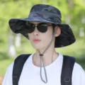 Men's camouflage bucket hat with wide brim, breathable mesh and windproof strap for outdoor sun protection. - Adjustable (55-60cm) / Camouflage Dark Gray