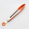 Orange stainless steel kitchen food tongs with silicone grip for cooking and serving. - Orange Food Tongs