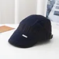 Detailed view of the dark blue autumn winter flat cap with stylish metal tag and pleated panels. - Adult Style (Head Circumference 55-58cm) Adjustable / Navy Blue (Retro Vertical Stripe Flat Cap)